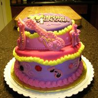 Hannah Montana Made this for my neighbors 6 year old girl. She wanted Hannah Montana, and jewels on the cake. I opted to forgo a lot of fondant...