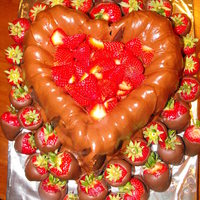 Chocolate Love A triple chocolate heart shaped cake surrounded by stuffed chocolate covered strawberries!