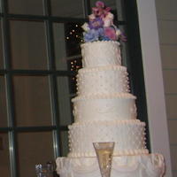 White Stacked Wedding Cake Son, Billy's, wedding cake. White on white buttercream icing with fresh flowers on top. Top tier, hand piped hearts; 2nd tier, fondant...