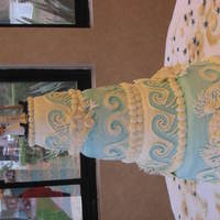 Ocean Theme Wedding Cake Daughter, Kerri's, wedding cake. Stacked 4 tiers. French Buttercream icing, white chocolate sea shells, royal icing coral branches,...