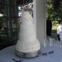 All White Stacked Wedding Cake 5 Tier White on White Stacked Wedding Cake. I used French Buttercream icing, handmade fondant pearls in graduated sizes, fondant stripes,...