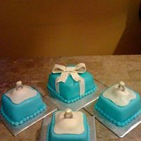 Rings Mini cakes covered in fondant with fondant bows. The rings are made out of chocolate. These were for my friends jewlery party she was...