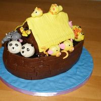 Noah's Ark I got the idea for this cake from the Debbie Brown book "50 easy party cakes". I used MMF almost everything. The animals were 50/...