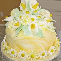 Wilton Fondant & Gumpaste Final Cake With Calla Lillies, Carnations, Daisies, Marbled Fondant The cake is lemon cream with lemon pie filling. The callas were done with a heart cutter. I did a different style of carnations that I like...