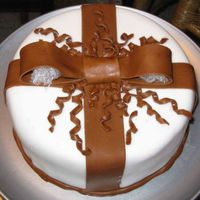 Wilton Iii Fondant Bow Wilton fondant tastes awful, but is nice to work with as a beginner. The cake was covered well but it got very late so the rest is slapdash...