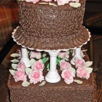 Wilton Iii Tiered Cake Fondant Rose Cornelli Lace Ruffle Chocolate Cake hell - almost 6 hours to torte, stack & crumb coat. Forget smoothing! The lace is covering alligator skin and cracks. The...