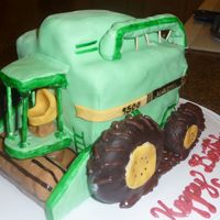 John Deere Combine white chocolate with raspberry cake, covered in mmf. my second 3-d cake.