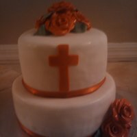 Church Cake bottom tier is wasc with strawberry filing and second tier is chocolate cake with chocolate ganache. the roses are fondant and gumpaste....