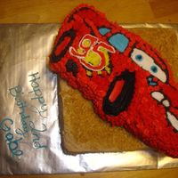 My Son's 2Nd Birthday This is a square white cake on the bottom, with b/c icing. Graham crackers on the side to make it look like sand. then the wilton cars cake...
