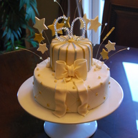 Grandma's 60Th Birthday White fondant 2 tier cake, gumpaste stars and beaded wires.