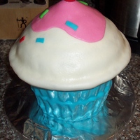 Giant Cupcake Made this just as practice for the cake I plan on making next weekend. Excuse the cake board...just a practice cake. I will do some things...