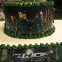 Gi Joe Cake White cake with cream cheese filling, butter cream icing. Edible images.TFL