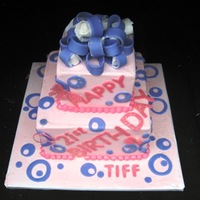 Tiffiny's Birthday White cake with butter cream icing , Cricut cut letters ,WOOHOO, fondant bow done at the last, still supported with wedges LOL