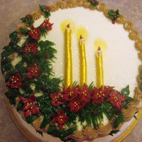 Christmas Candles Red velvet cake with cream cheese icing , butter cream basketweave, poinsettias and pine needles. candles are made from modeling choc...