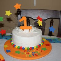 1St Birthday Carnival Theme Buttercream,fondant work. ***Wires inserted in straws before inserting into cake.