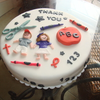 Teacher Appreciation This cake was for teacher appreciation day. Simple, quick cake I made. Vanilla with chocolate filling and fondant accents.