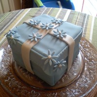 Gift Box Cake I made this cake for my good friend on her birthday. It's 5 layer chocolate cake with chocolate filling. All decorations are fondant...