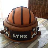 Basketball Team Trophy Cake I made this cake for my daughter's basketball team to celebrate the end of the season. Thanks for looking. It's chocolate cake...