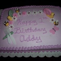 Baby Bug Cake butter cream icing with fondant and gumpaste accents .