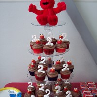 Elmos Everywhere! I did these for my grand baby's 2nd birthday. She is an elmo freak! The Elmo heads are fondant, and the number 2's are piped out...