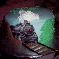 Train Track Cake I did this all in butter cream. the train is a photo cut and laminated. This was shamelessly copied from a design on here. Not my original...
