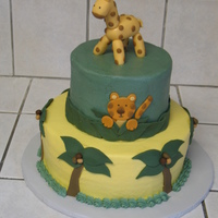 Baby Shower Cake This was a jungle theme baby shower cake. I based the colors and design off the bedding for the nursery. Iced in buttercream. Tiger, trees...