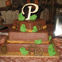 Western Groom's Cake This was a three-tiered western theme groom's cake. Chocolate with cinnamon mocha buttercream filling. Iced in chocolate buttercream...