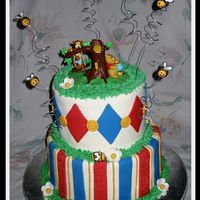 Winnie The Pooh Winnie the Pooh cake for a 1st birthday. Top tier was Rainbowlicious flavor for the kids. 6 vibrant colors of red/orange, yellow/green,...