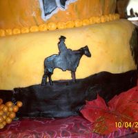 Cowboy Silhouette Fondant cowboy painted with food coloring. This was one of the silhouettes on the barn dance cake