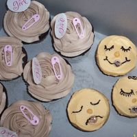 Baby Girl Cupcakes And Baby Face Cupcakes Cupcakes with baby girl pick are "inside out snickers" cupcakes....chocolate cake, caramel and peanut filling, and malt...