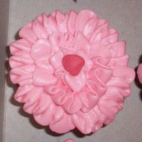 Strawberry Flower Cupcakes Strawberry cupcake with strawberry buttercream. Strawberry candy center. Used a flower tip to make a begonia type flower. They were a hit...