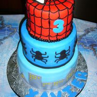 Spiderman! Chocolate and vanilla cake layered with chocolate and vanilla buttercream with chocolate chips. All MFF fondant decorations except the web...