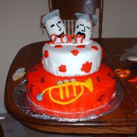 Graduation Cake This cake was made for a senior at the local high school. He was in drama and played the trumpet. The school colors are scarlet and grey...