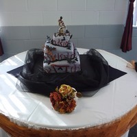 Halloween Wedding First time doing a topsy turvy cake and it had to be a square one. I pulled it off and the bride loved it!