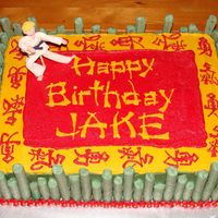 Kung Fu Panda Inspired Cake Buttercream covered butter cake. Green "white" chocolate covered pretzels are the "bamboo". "Jake" is made of...