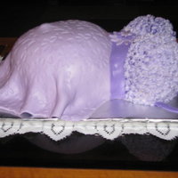 Lilac Belly Cake This was a joint effort with my daughter. We used MMF and an impression mat. The bodice was piped on with light and dark lilac buttercream...