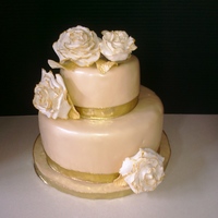 50Th Wedding Anniversary This cake was created for a 50th Wedding Anniversary. The bottom tier is Lemon Cake with Lemon Filling, and the top tier is yellow cake...