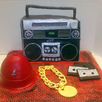 Ode To Hip Hop This cake is a tribute to the Hip Hop Era of the 80's. The BoomBox and hat are lemon cake with buttercream frosting covered in fondant...
