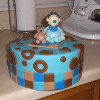 Baby Boy Shower this is a dummy layer topper that i made for a shower. Gumpaste teddy bear and baby and the rest fondant.
