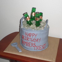 Beer Bucket 6 layuer chocolate cake with chocolate cream filling. Sugar ice and beer bottles. fondant opener.