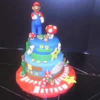 Mario Cake Cake is vanilla. Decorations are modeling chocolate & MMF.
