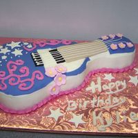 Guitar Cake For Hannah Fan Made this for a 6 year old's party. Dad wanted a guitar cake with a Hannah Montana feel. This is what I came up with. Thanks to all...