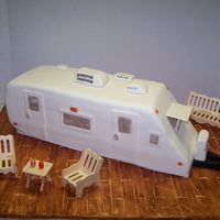 Travel Trailer Cake Made this to take to the lake this weekend. My in-laws just bought a place on Lake Gaston, complete with a trailer. This is two 1/2 sheet...