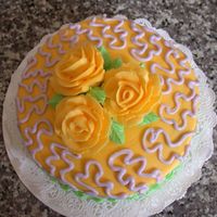 Mom's Birthday Cake I got a little loose with my cornelli lace ... it's much to large! But I like the way the roses turned out. All buttercream.