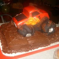Motorized Monster Truck Cake Vanilla bean cake w/ chocolate bc covered in bc.Carved from a 9x13 cake. Motor installed to turn from tires covered in fondant. Working...