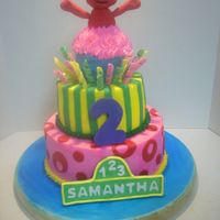 Sesame Street Cake I got the idea off of here. Gumpaste and fondant elmo and abby. Buttercream w/ fondant accents