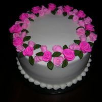 Laura_Rose.jpg Buttercream with fondant flowers.