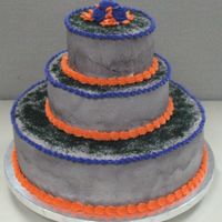 Halloween Themed Cake Bottom layer is devils food cake filledwith a chocolate fudge frosting and the top 2 layers are white cake filled with cream cheese...