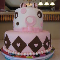 Brown And Pink Baby Shower Cake I made this for my friends baby shower. Its was devils food cake with cookies and cream filling on the bottom layer and orange cake with...