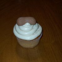 Peanut Butter Jelly Cupcakes This are peanut butter cupcakes filled with grape jelly and frost with top with buttercream frosting. The peanut are made with fondant